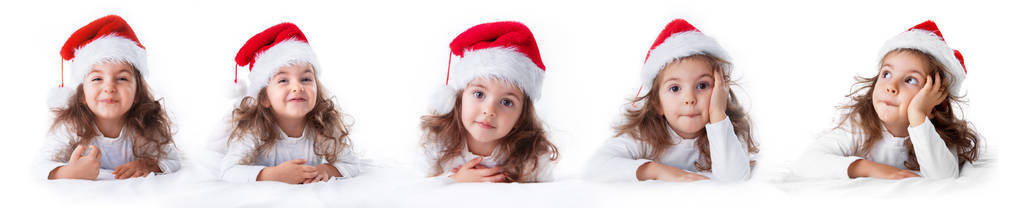 小女孩戴圣诞老人帽的表情微笑。圣诞节. 2020年新年快乐