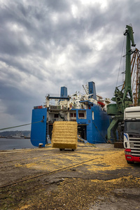 unloading bales 