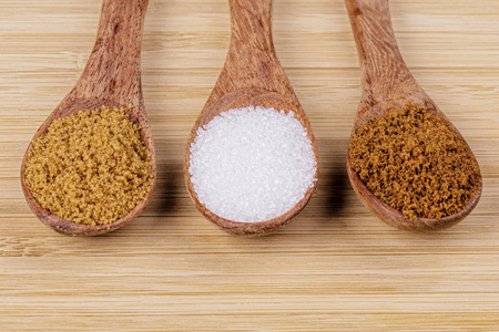 spoonfullspoonfull of different sugars, light and dark brown