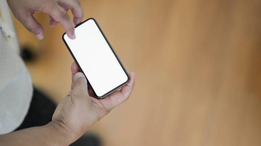 Cropped shot of businessman touching blank screen smartphone whi