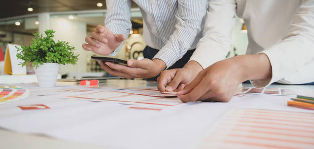 Closeup view of professional UI web developer team working on s