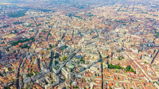 Milan, Italy. Roofs of the city aerial view. Cloudy weather, Aer