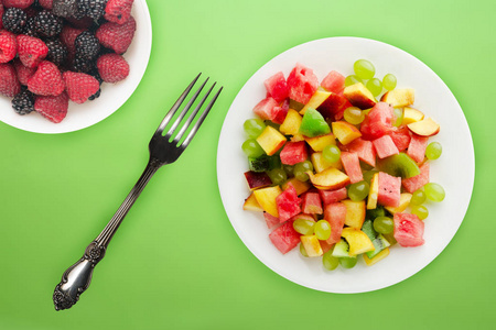  healthy food. fresh fruit salad on a white  plate. vegan food o