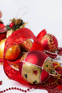 Christmas  decorations with red ribbon around white  background 