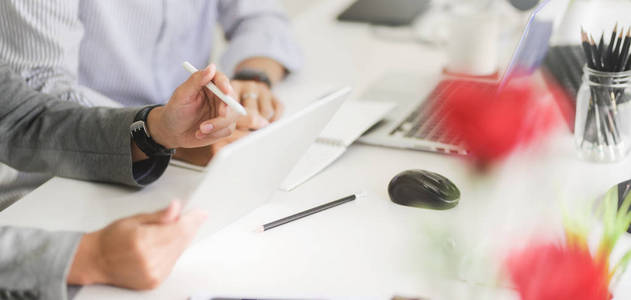 Cropped shot of professional business team working on their stra