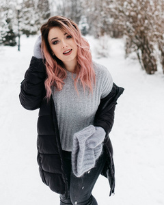 Young Blonde Woman in Gray Sweater and Black Jacket is Enjoying 