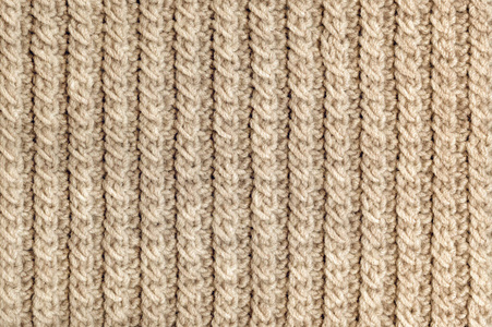 Knit texture of beige wool knitted fabric with cable pattern as 