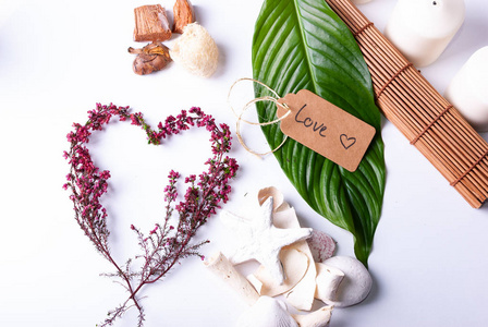 A collection of wellness items and a heart built out of branches