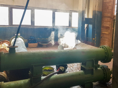 steam from the pipe. under pressure in production. factory break