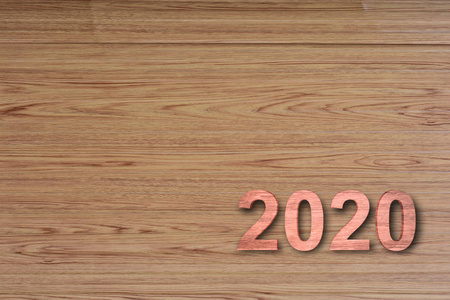 木材纹理背景上的木材编号2020设计符号