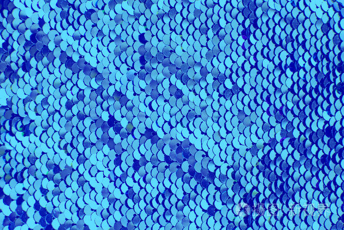 有蓝色亮片的布片闪光的背景亮片纹理
