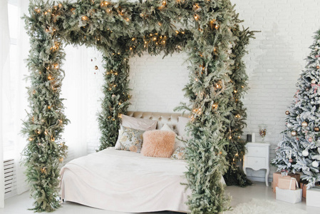 A spacious white light bedroom in a loft style with a decorated 