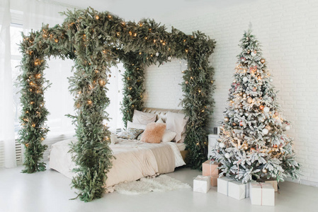 A spacious white light bedroom in a loft style with a decorated 