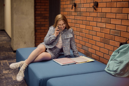 Girl student sit in the corridor of the university  university 