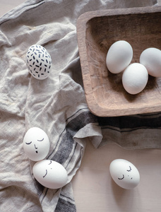 monochrome easter eggs with faces top view. Easter holiday conce