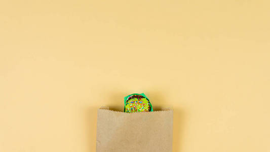 Colorful muffin dancing on yellow background. Concept of bakery 