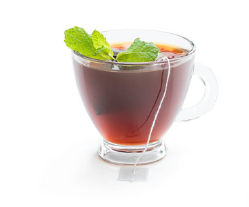 Cup of black tea with tea bag isolated on white 