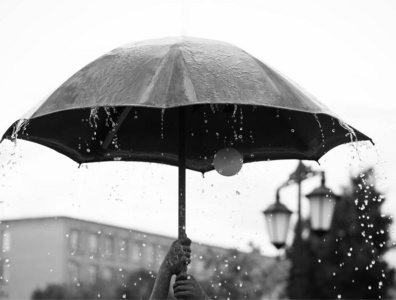 Russia, Near Moscow  August 12, 2019 Girl under umbrella duri