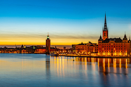 Sunset view of Town hall viewed behind gamla stan in stockholm, 