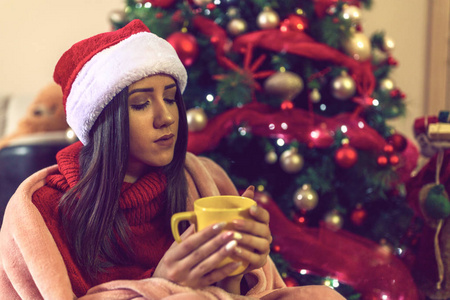  girl drinking coffee in christmas at home 
