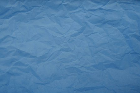 浅蓝色皱褶纸纹理背景。抽象模式