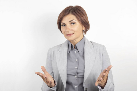 Beautiful young business girl in a suit thinks over her project 