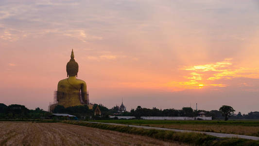 Big buddha statue at sunset time. 