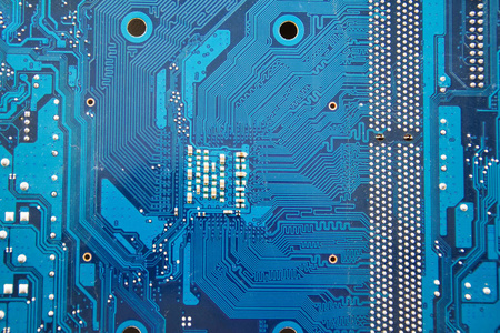 电脑主板PCB特写。电子和计算机技术。科学知识电子维修信息恢复技术。黄色背景。