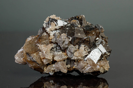 macro mineral cassiterite stone on gray background 