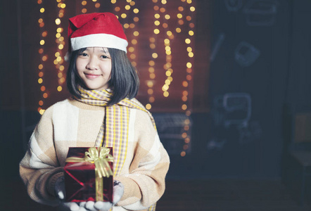 prety girl holding gift box in Christmas festival and happy new 