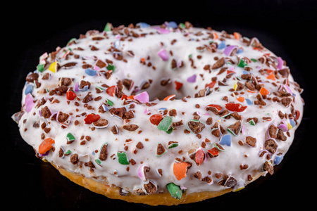 Donut on a dark kitchen table. 