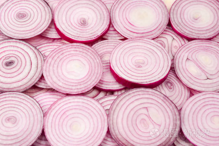 Onion slices as a background. Top view. 