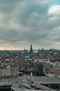 Old centre of the city of Amsterdam under cloudy sky in autumn. 