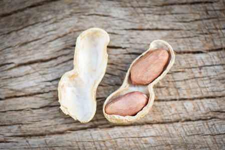 Roasted peanuts on a wooden background  Shell peanut in shells 