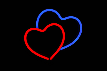 Red and blue heart in one neon sign on isolated black background