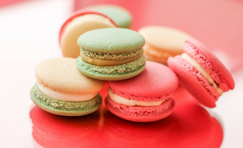 French macaroons on red background, parisian chic cafe dessert, 