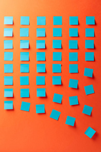 Blue empty stickers on a orange background. 