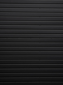 钢墙背景黑色波纹金属板纹理墙面.镀锌钢背景.照片