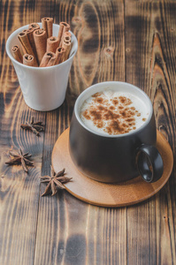 Eggnog. Traditional christmas cocktail in a black mug and white 