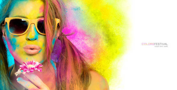 Beautiful young woman covered in rainbow colored powder. Colors 