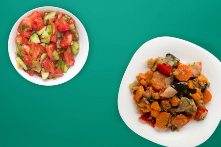 vegetable stew on a white plate. stewed vegetables on a colored 