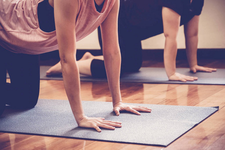 Group of young healthy Asian women practicing yoga  lesson with 