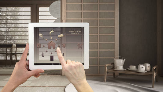 远程房间数字平板电脑上的智能远程家庭控制系统.带有应用图标的设备.