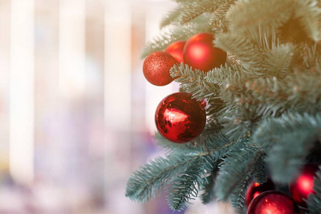 Red ball on Christmas tree in house 