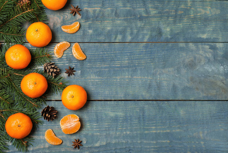 Flat lay composition with tangerines on blue wooden background. 