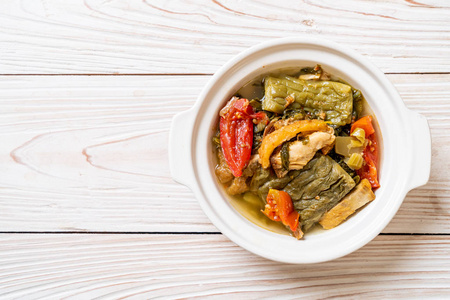 Bitter gourd and preserved mustard green soup with pork 