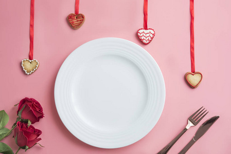 Valentines day dinner on pink background. View from above. 