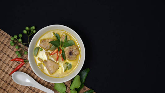 Thai cuisine concept  chicken green curry and ingredients on bl