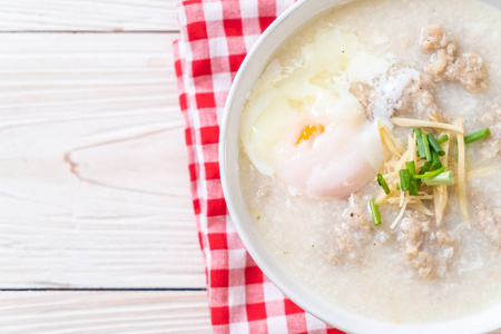 congee with minced pork in bowl 