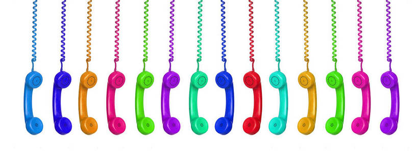 Manu colorful vintage phones hanging of a cable 